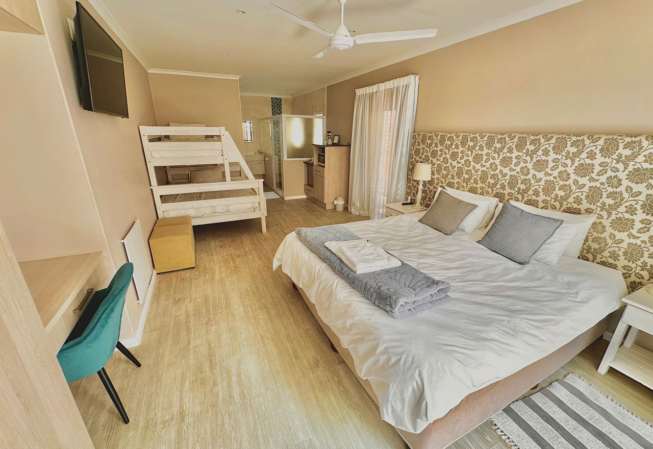 Retreat on Main | Luxury family room with private deck and kitchenette